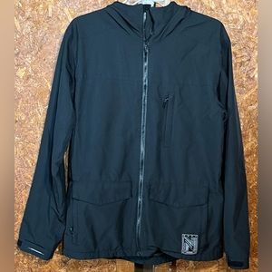 Small men’s Neff black rain jacket with a hood, pockets, and a internal lining.